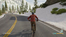 Riders Republic Complete Edition gameplay screenshot for PC showcasing scenic cycling along a snow-lined road in Yosemite's Illilouette Bowl region. Unlock your Ubisoft Connect game key today at RushGame.co