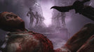 In-game screenshot from Scorn Deluxe Edition on Steam, showing a gruesome, horror-themed environment with a mutilated body in the foreground and twisted humanoid statues lining a staircase. Buy your Scorn Deluxe Edition Steam key instantly at RushGame.co