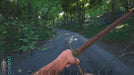 SCUM Steam Key gameplay screenshot with a player using a bow at sunset near a coastal village and boats. Get your SCUM Steam Key at RushGame.co and explore, craft, and survive on the island—digital code delivery is instant