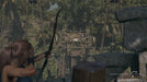 Shadow of the Tomb Raider Definitive Edition gameplay image with Lara Croft aiming a bow at an ancient mechanism. Unlock the adventure with a Steam Key from RushGame.co – your source for instant digital codes