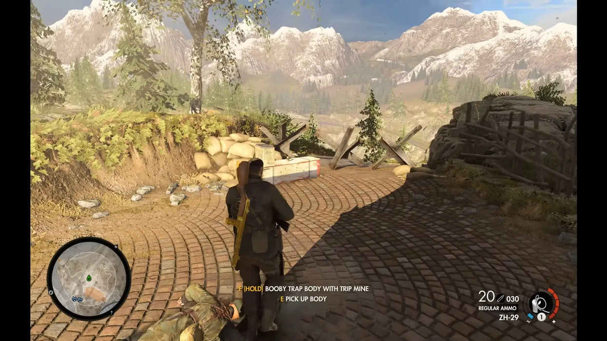 Sniper Elite 4 Deluxe Edition Steam gameplay with the main character setting traps in a mountain pass. Get your digital game key at RushGame.co