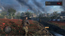 Sniper Elite 5 Complete Edition Xbox One screenshot showing the main character crouching on a balcony overlooking an enemy encampment. Unlock your Xbox digital code for Sniper Elite 5 at RushGame.co.