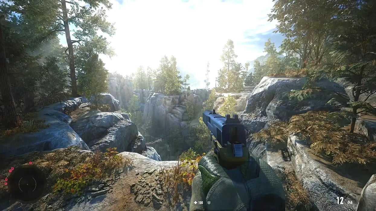 In-game view from Sniper Ghost Warrior Contracts 2 Deluxe Arsenal Edition Steam Key, with the player aiming a silenced pistol while exploring a sunlit, forested canyon. Unlock this immersive sniping adventure with a Steam code from RushGame.co