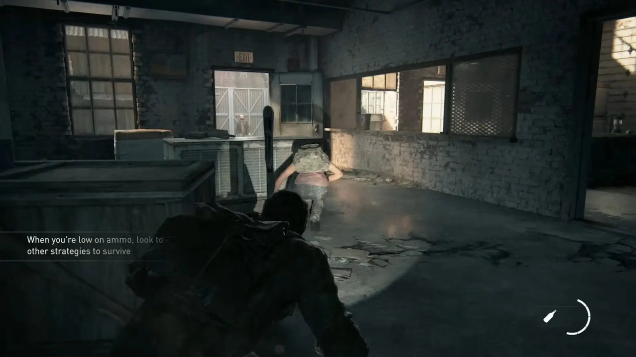 The Last of Us Part I gameplay – low ammo survival – Tense gameplay moment as Joel crawls through a ruined building while enemies patrol, emphasizing stealth and resource management in The Last of Us Part I for PC. Available at RushGame.co